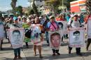 Relatives of the 43 missing students protest with their portraits at the central square in Chilpancingo, Guerrero State, Mexico on September 15, 2015