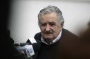 Uruguayan President Mujica speaks to the media after a joint news conference with Brazilian President Luis Inacio Lula Da Silva at the seventh regiment of mechanized cavalry barracks in Santana Do Livramento