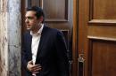Greek Prime Minister Alexis Tsipras arrives for a parliament session of Syriza party lawmakers at the Greek Parliament in Athens