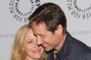 Actors Gillian Anderson and David Duchovny attend "The Truth Is Here: David Duchovny and Gillian Anderson on The X-Files" at The Paley Center for Media on Saturday, Oct. 12, 2013 in New York. (Photo by Evan Agostini/Invision/AP)