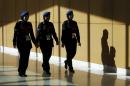 Police walk at the ASEAN summit in Kuala Lumpur, Malaysia,