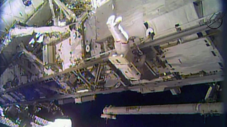 In this image made from video provided by NASA, astronaut Rick Mastracchio performs a space walk outside the International Space Station on Saturday, Dec. 21, 2013. Mastracchio and Michael Hopkins ventured out of the station to try to revive a crippled cooling line. (AP Photo/NASA)