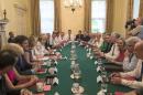 Britain's Prime Minister Theresa May (centre, left) holds her first Cabinet Meeting at Downing Street, in London