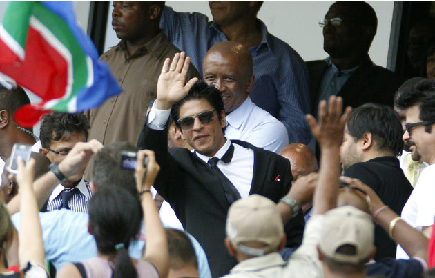 India&#39;s film actors Shahrukh Khan, center, waves towards the crowd during the Twenty20 cricket match between South Africa and India in Durban, South Africa on Sunday Jan. 9, 2011. (AP Photo/Themba
