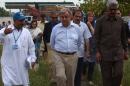 Head of the UNHCR Antonio Guterres (C) and Pakistan's Federal Minister of States and Frontier Regions Abdul Qadir Baloch (R) during a visit to the UNHCR repatriation center in Peshawar on June 23, 2015