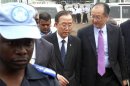 U.N. peacekeeper escorts U.N. Secretary-General Ban and World Bank President Kim during their joint trip to Goma