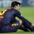 Barcelona's Pique grimances after injurein during their Champions League Group G soccer match against Spartak Moscow in Barcelona