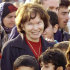 FILE - In this Feb. 20, 2001, file photo, former French first lady Danielle Mitterrand poses with Kurdish refugees as she visits a makeshift housing camp in Frejus, southern France.  Danielle Mitterrand, a member of the French Resistance and outspoken advocate for human rights who broke the mold as first lady alongside France's first Socialist president, has died it is announced Tuesday Nov. 22, 2011.  Mitterrand, who was 87, died overnight Monday to Tuesday Nov.22  2011, after being hospitalized at Georges Pompidou hospital in Paris for fatigue.  (AP Photo/Lionnel Cironneau, file)