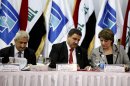Sarbast Mustafa, left, chairman of the Independent High Electoral Commission of Iraq, and his colleagues, Katee al-Zobaie, center, Kolshan Kamal, right, attend a press conference in Baghdad, Iraq, Saturday, May 4, 2013. Iraqi electoral officials say a coalition led by Iraq's prime minister has won the largest single bloc of seats in seven of 12 provinces participating in local elections, and tied in eighth, although it failed to achieve a majority in any of the districts. (AP Photo/ Hadi Mizban)