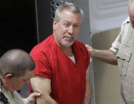 FILE - In this May 8, 2009 file photo, former Bolingbrook, Ill., police sergeant Drew Peterson arrives at the Will County Courthouse in Joliet, Ill., for his arraignment on charges of first-degree murder in the 2004 death of his former wife Kathleen Savio, who was found in an empty bathtub at home. Peterson's wisecracking, limelight-hogging, sunglasses-wearing lawyers faced the media horde every day of the former suburban Chicago police officer's 2012 trial — one that ended with a murder conviction and a falling out among the erstwhile colleagues. But the lawyerly war of words in public between lead trial counsel Joel Brodsky and former partner-turned-nemesis Steve Greenberg that began within hours of the trial's end will come to a head Tuesday, Feb. 19, 2013 at a hearing where the defense will argue Peterson deserves a new trial because Brodsky did a shoddy job. (AP Photo/M. Spencer Green, File)