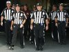 FILE - In this Aug. 9, 2012, file photo, officials walk towards the field for an NFL football game between the Buffalo Bills and the Washington Redskins in Orchard Park, N.Y. The NFL and referees' union reached a tentative agreement on Wednesday, Sept. 26, to end a three-month lockout that triggered a wave of frustration and anger over replacement officials and threatened to disrupt the rest of the season. (AP Photo/Bill Wippert, File)