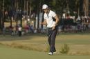 Martin Kaymer, of Germany, reacts to his putt on the 13th hole during the final round of the U.S. Open golf tournament in Pinehurst, N.C., Sunday, June 15, 2014. (AP Photo/Charlie Riedel)
