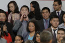 Ju Hong, third from top left, interrupts President Barack Obama's speech about immigration reform, Monday, Nov, 25, 2103, at the Betty Ann Ong Chinese Recreation Center in San Francisco. (AP Photo/Jeff Chiu)