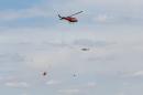 Helicopters battle a wildfire near Fort McMurray