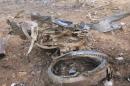 Debris is seen at the crash site of Air Algerie flight AH5017 near the northern Mali town of Gossi