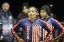 American bob team Jazmine Fenlator, right, and Lolo Jones look up after coming to a stop after racing in the United States women's bobsled team trials Friday, Oct. 25, 2013, in Park City, Utah. Fenlator and Jones came in third place. (AP Photo/Rick Bowmer)