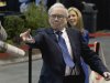 Warren Buffett, chairman and CEO of Berkshire Hathaway tosses a newspaper  during a newspaper tossing competition  in Omaha, Neb., Saturday, May 5, 2012. Berkshire Hathaway is holding it's annual shareholders meeting this weekend. (AP Photo/Nati Harnik)