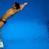 He Chong competes in the men's 3m springboard semi-finals during the diving event at the London 2012 Olympic Games