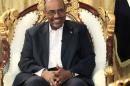 Sudan's President Omar al-Bashir smiles during an interview with the Russia Today news channel at the Presidential Palace in Khartoum