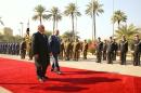 Iraq's Prime Minister Haider al-Abadi and his Turkish counterpart Yildirim review a guard of honour during a welcoming ceremony in Baghdad