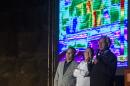 Egyptian Minister of Antiquities Mamdouh el-Damati (L) speaks in front of the great pyramid of Khufu (Cheops) in Giza on the outskirts of Cairo on November 9, 2015, during an infrared thermography experiment to map out the temperature of the walls