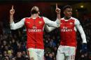 Arsenal's striker Olivier Giroud (L) celebrates scoring his team's first goal during the English Premier League football match against Crystal Palace at the Emirates Stadium in London on January 1, 2017