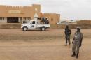 United Nations peacekeepers stand guard outside the headquarters of former Islamist rebel group High Council for the Unity of Azawad in Kidal