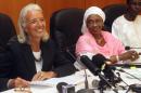 International Monetary Fund Managing Director Christine Lagarde (L), Mali's Economy and Finance Minister Bouare Fily Sissoko (C) and Mali's Junior Minister in Charge of Budget Madani Toure give a press conference in Bamako on January 10, 2014