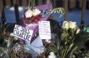Flowers are left with notes written in French reading "I am Charlie" at the French Embassy in Washington, DC, January 8, 2015, in response to the satirical magazine Charlie Hebdo's attack by three gunmen