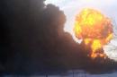 In this image made from a video provided by Darrin Rademacher, a fireball goes up at the site of an oil train derailment Monday, Dec 30, 2013, in Casselton, N.D. The train carrying crude oil derailed near Casselton Monday afternoon. Several explosions were reported as some cars on the mile-long train caught fire. (AP Photo/Darrin Rademacher)