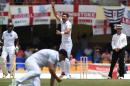 English fast bowler James Anderson celebrates after equaling the highest English wicket taker record with 383 on day five of the first cricket Test match between West Indies and England in St John's, Antigua on April 17, 2015