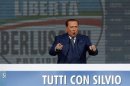 Italy's former Prime Minister Berlusconi gestures during a meeting in Rome