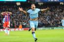 Manchester City's Sergio Aguero celebrates scoring his sides third goal of the game during the UEFA Champions League match at the Etihad Stadium, Manchester, England, Tuesday Nov. 25, 2014. (AP Photo/PA, Tim Goode) UNITED KINGDOM OUT NO SALES NO ARCHIVE