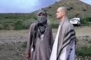 FILE - In this file image taken from video obtained from Voice Of Jihad Website, which has been authenticated based on its contents and other AP reporting, Sgt. Bowe Bergdahl, right, stands with a Taliban fighter in eastern Afghanistan. The Taliban said Friday, June 6, 2014, that Bergdahl was treated well during the five years they held him captive and was even allowed to play soccer with the men holding him. (AP Photo/Voice Of Jihad Website via AP video, File)