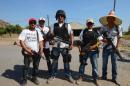 Members of the so-called self-defense groups pose for a picture at Antunez community, Michoacan state, Mexico, on February 15, 2014