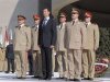 File handout photo of Syria's President Assad standing with Fahad Jassim al-Freij and Daoud Rajha in Damascus