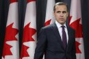 Mark Carney arrives at a news conference upon the release of the Monetary Policy Report in Ottawa