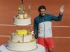 Nadal of Spain poses with his birthday cake after winning his men's singles match against Nishikori of Japan at the French Open tennis tournament in Paris