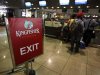 Kingfisher Airlines customers wait in a check-in queue at Mumbai's domestic airport