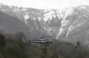 A rescue helicopter takes off from La Seyne les Alpes, French Alps, Tuesday, March 24, 2015, as search-and-rescue teams struggle to reach the remote, snow-covered crash site of Germanwings passenger plane. A Germanwings passenger jet carrying 150 people crashed Tuesday in the French Alps as it flew from Spain's Barcelona airport to Duesseldorf, authorities said. (AP Photo/Claude Paris)