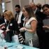 People speak with recruiters from jewelry and gem companies during the GIA Jewelry Career Fair in New York