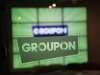 In this Thursday, Sept. 22, 2011, file photo, the Groupon logo is etched in glass in the lobby of the online coupon company's Chicago offices. Groupon's stock is tumbling as insiders are selling their shares after a post-IPO prohibition was lifted.  (AP Photo/Charles Rex Arbogast)