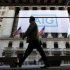 A banner for American International Group Inc hangs on the facade of the New York Stock Exchange