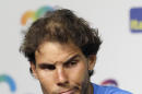 Rafael Nadal, of Spain, pauses during a news conference at the Miami Open tennis tournament in Key Biscayne, Fla., Saturday, March 26, 2016. Nadal faded in the subtropical heat and retired after falling behind in the third set of his opening match Saturday at the Miami Open against Damir Dzumhur. (AP Photo/Alan Diaz)