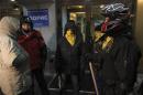 Anti-government protesters wait outside the hospital where opposition activist Dmytro Bulatov is being treated in Kiev