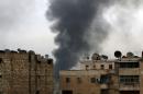 Smoke rises after strikes on the rebel-held besieged neighbourhoods of eastern Aleppo