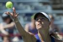 Angelique Kerber, from Germany, tosses the ball to serve to Caroline Garcia, of France, during second round play at the Rogers Cup tennis tournament Wednesday, Aug. 6, 2014 in Montreal. (AP Photo/The Canadian Press, Paul Chiasson)