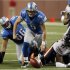 Detroit Lions quarterback Matthew Stafford chases the ball after a fumble and before Chicago Bears defensive end Julius Peppers recovers the ball during the first half of their NFL football game in Detroit,