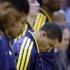 Indiana Pacers' George Hill pauses during a moment of silence for those who were killed and injured in the Connecticut elementary school shooting before an NBA basketball game against the Philadelphia 76ers, Friday, Dec. 14, 2012, in Indianapolis. (AP Photo/Darron Cummings)