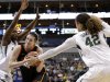 Baylor guard Kimetria Hayden (1) and center Brittney Griner (42) defend against a drive by Oklahoma State forward Liz Donohoe (4) in the second half of an NCAA college basketball game in the Big 12 women's tournament Sunday, March 10, 2013, in Dallas. Donohoe had 20-points in the 77-69 loss to Baylor.  (AP Photo/Tony Gutierrez)